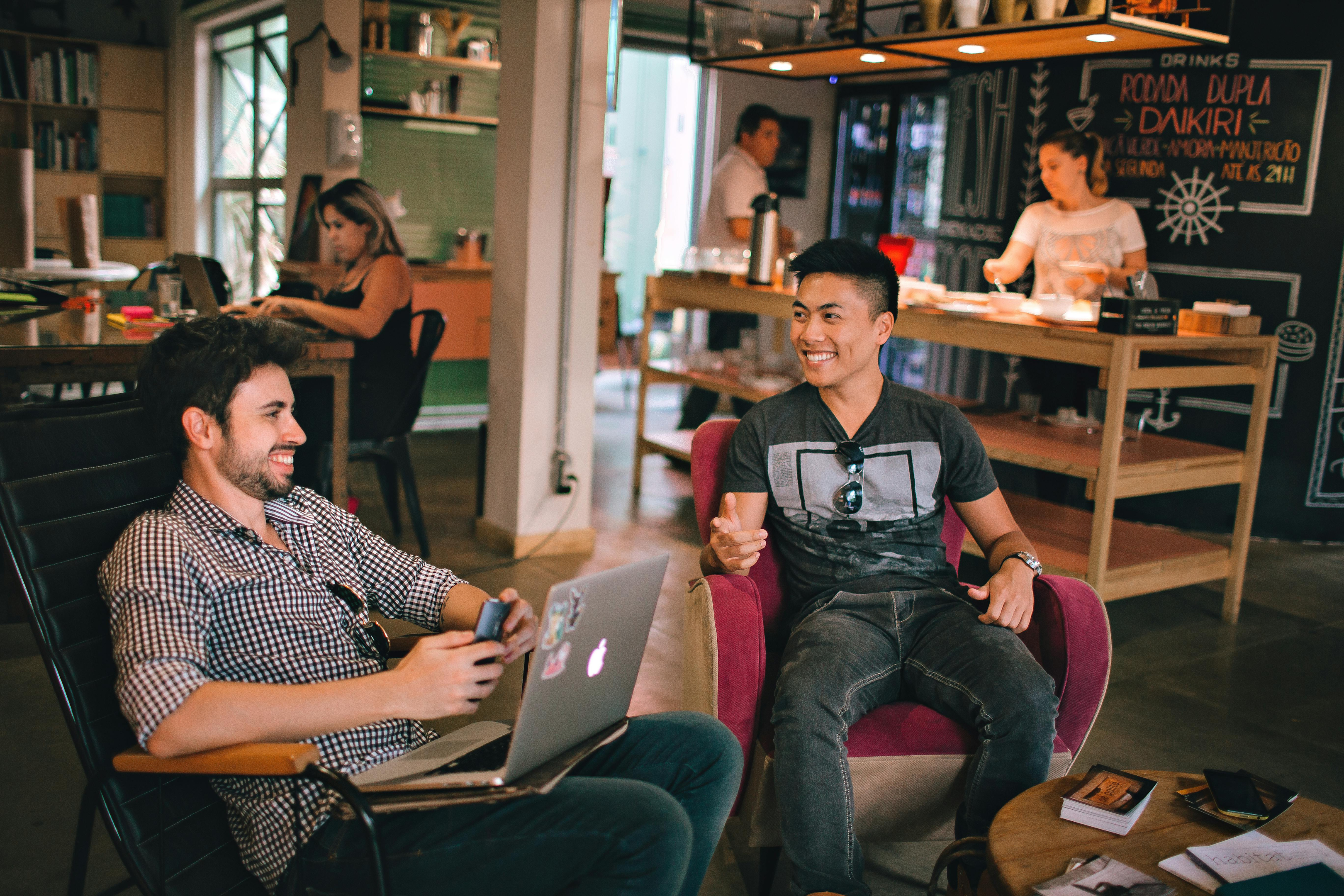 Young workers having a meeting in a trendy, colourful office.