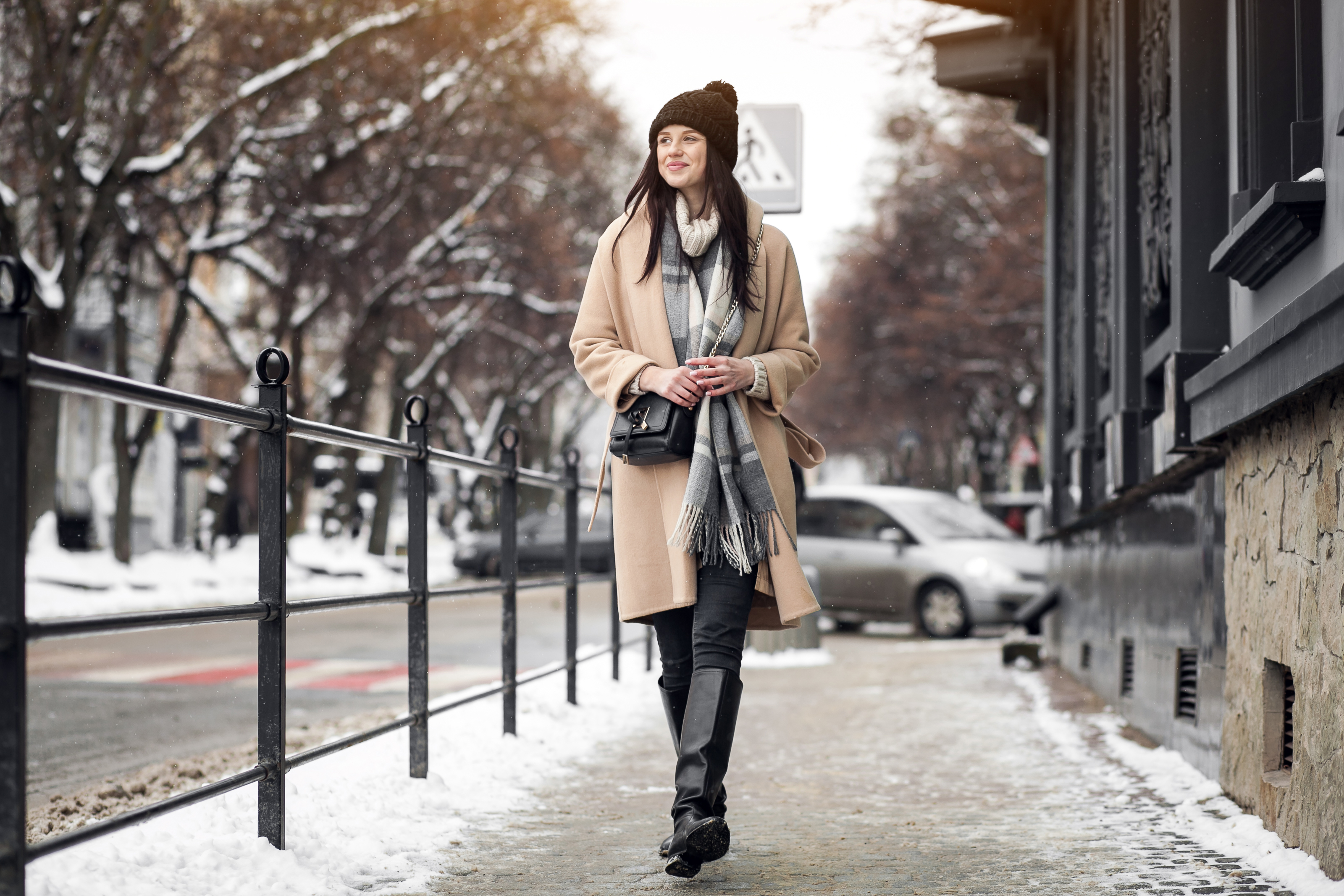 A woman taking a walk on a frosty day in the city