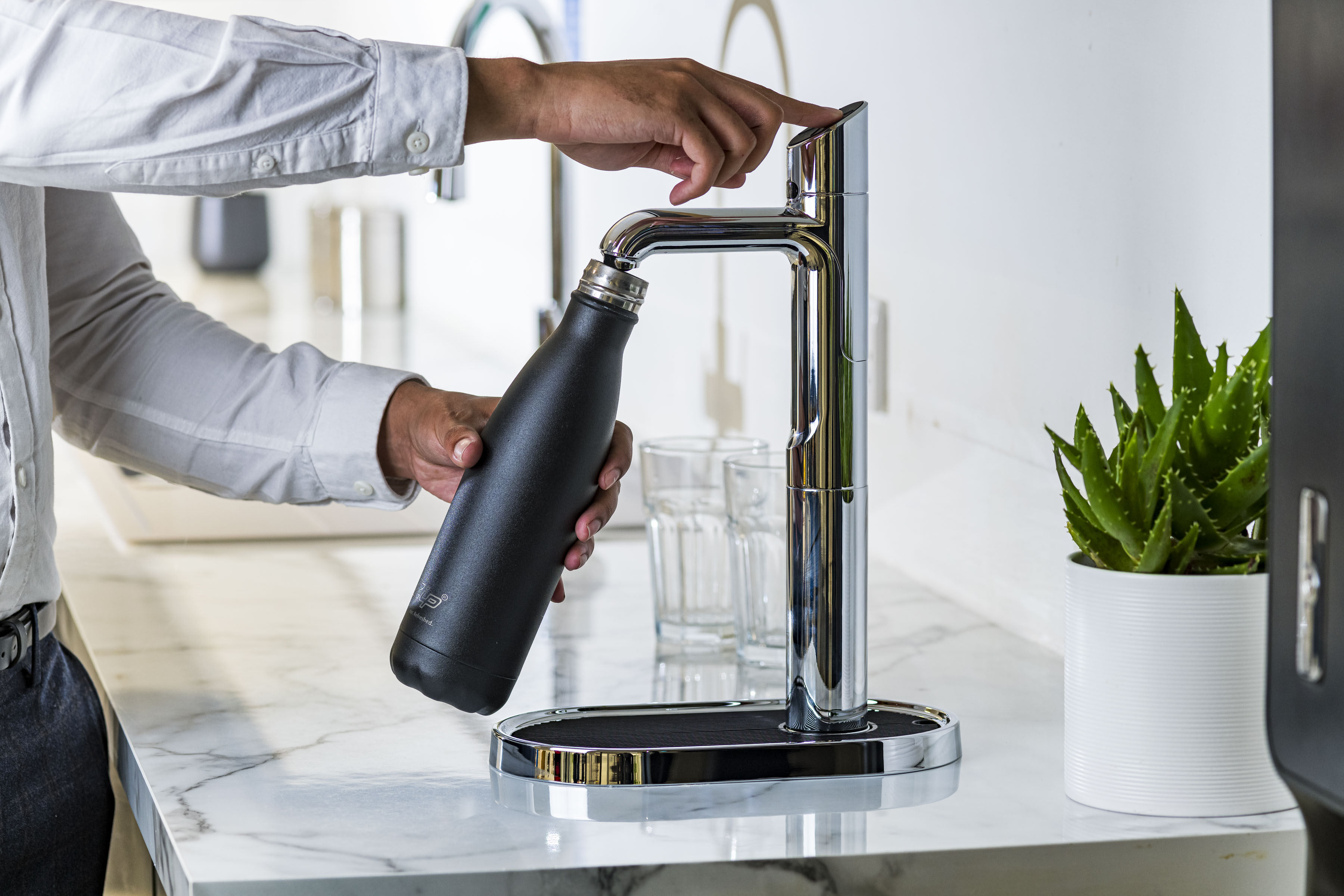 A Zip tap used to refill a water bottle