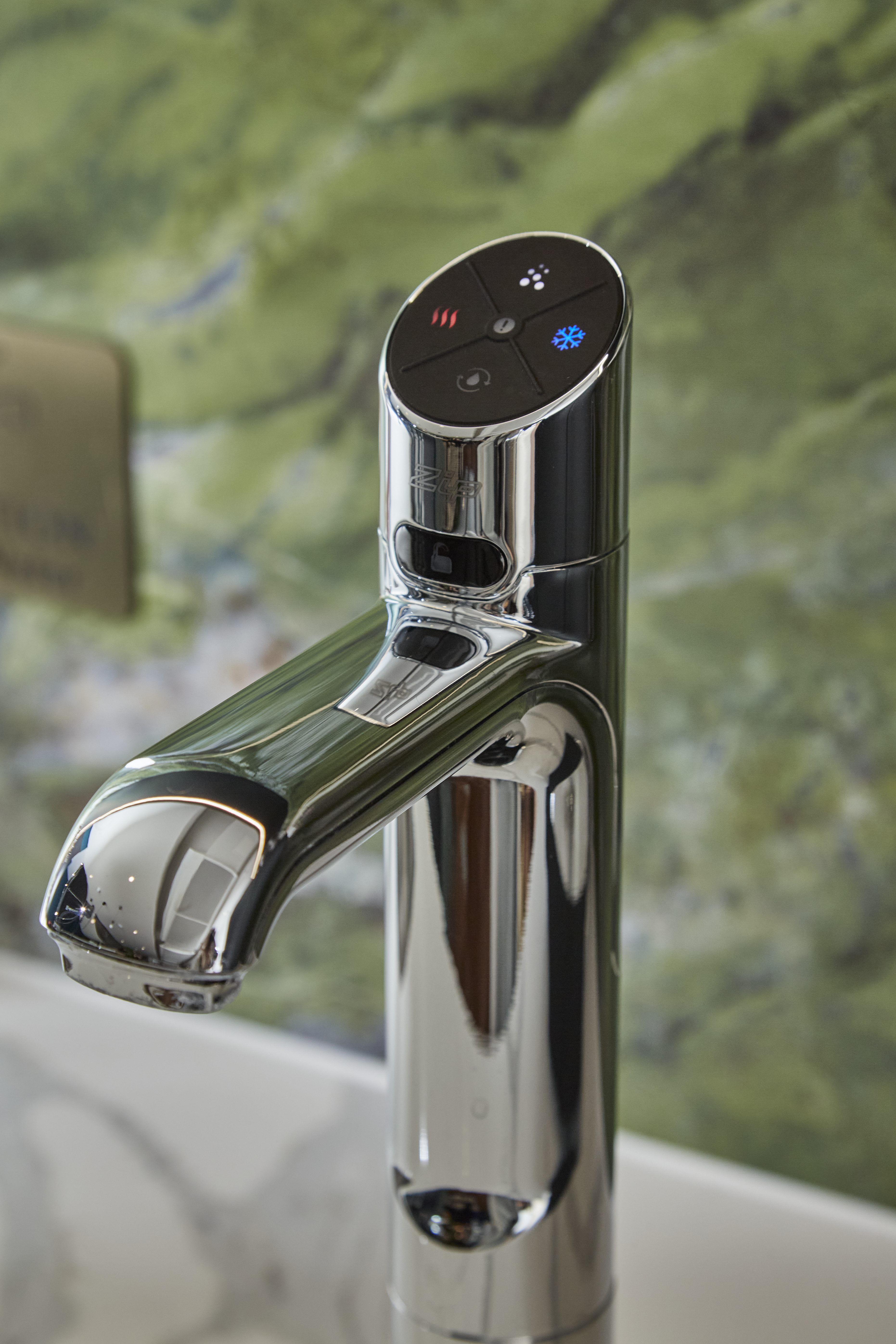 Silver HydroTap in a modern kitchen with green marble