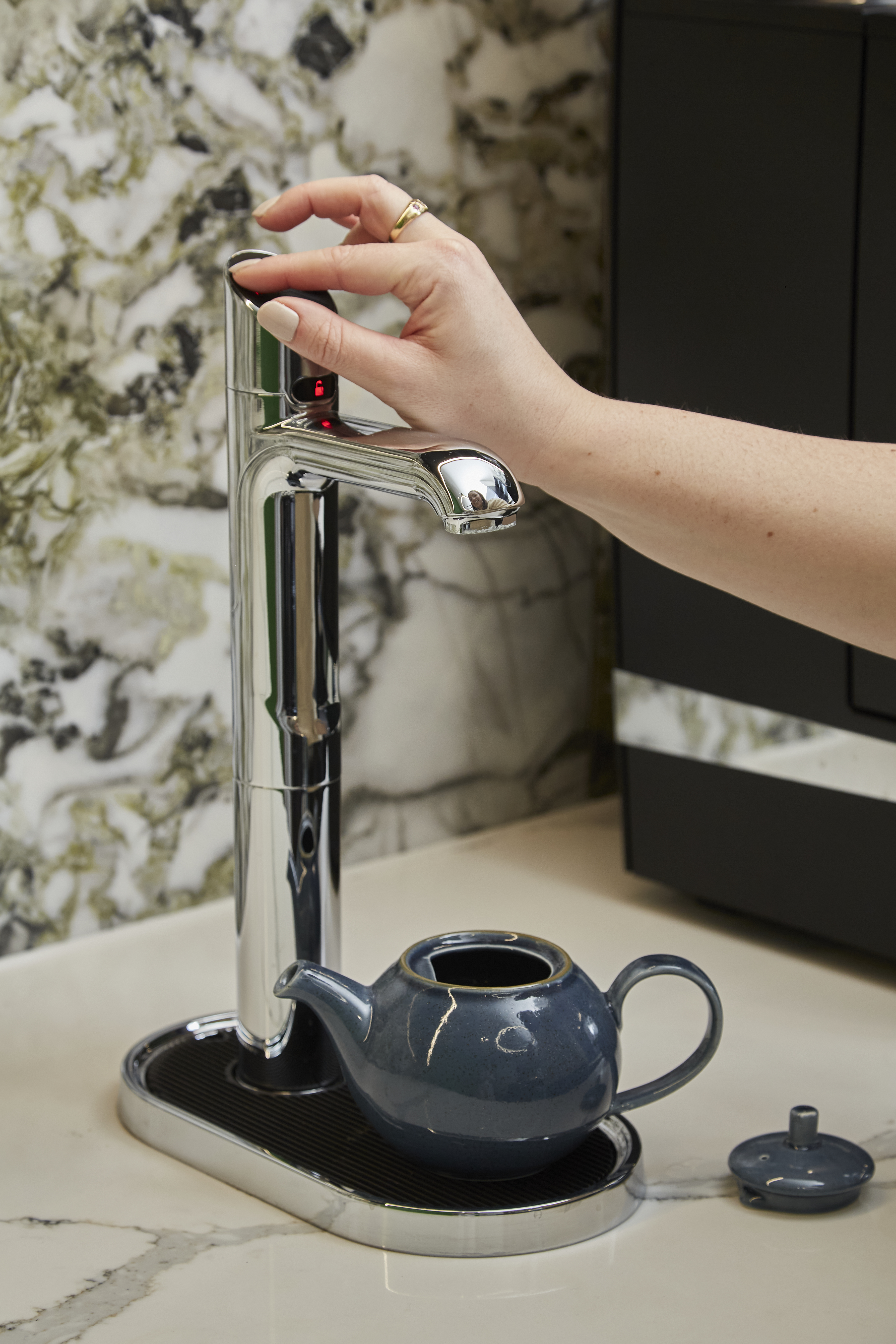 A Zip tap filling a teapot.