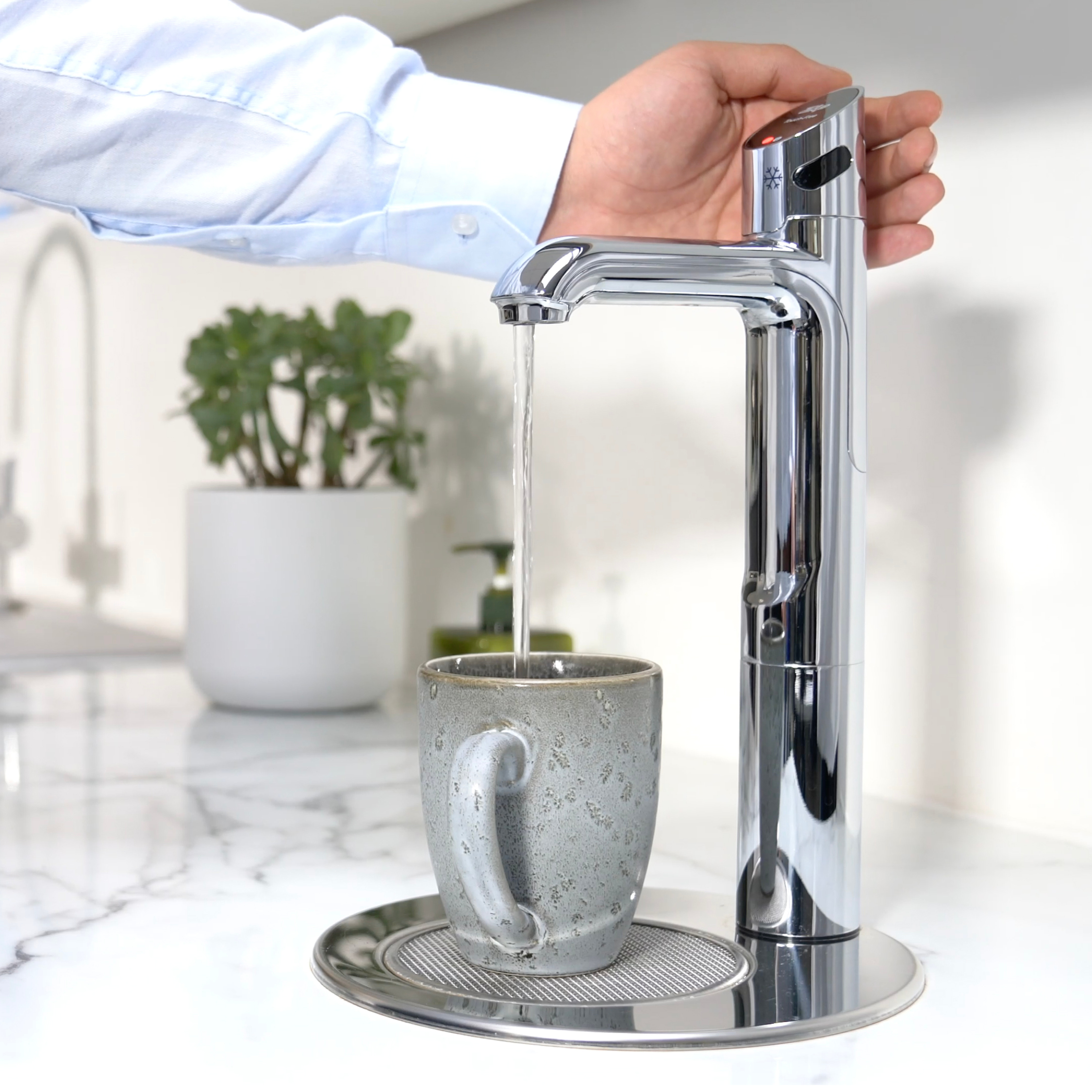 Zip HydroTap dispensing boiling water into a mug.