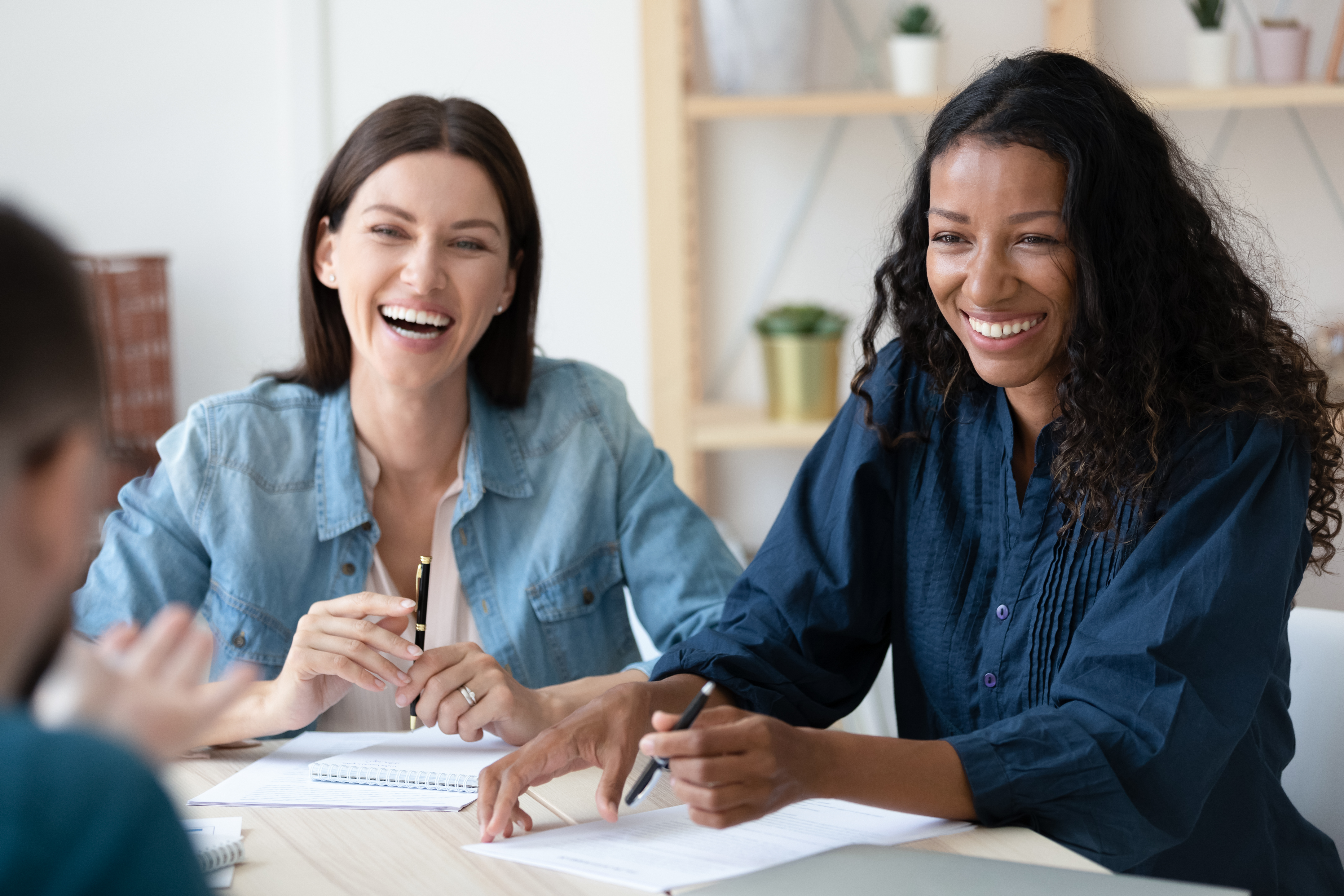 Two female colleagues taking a meeting