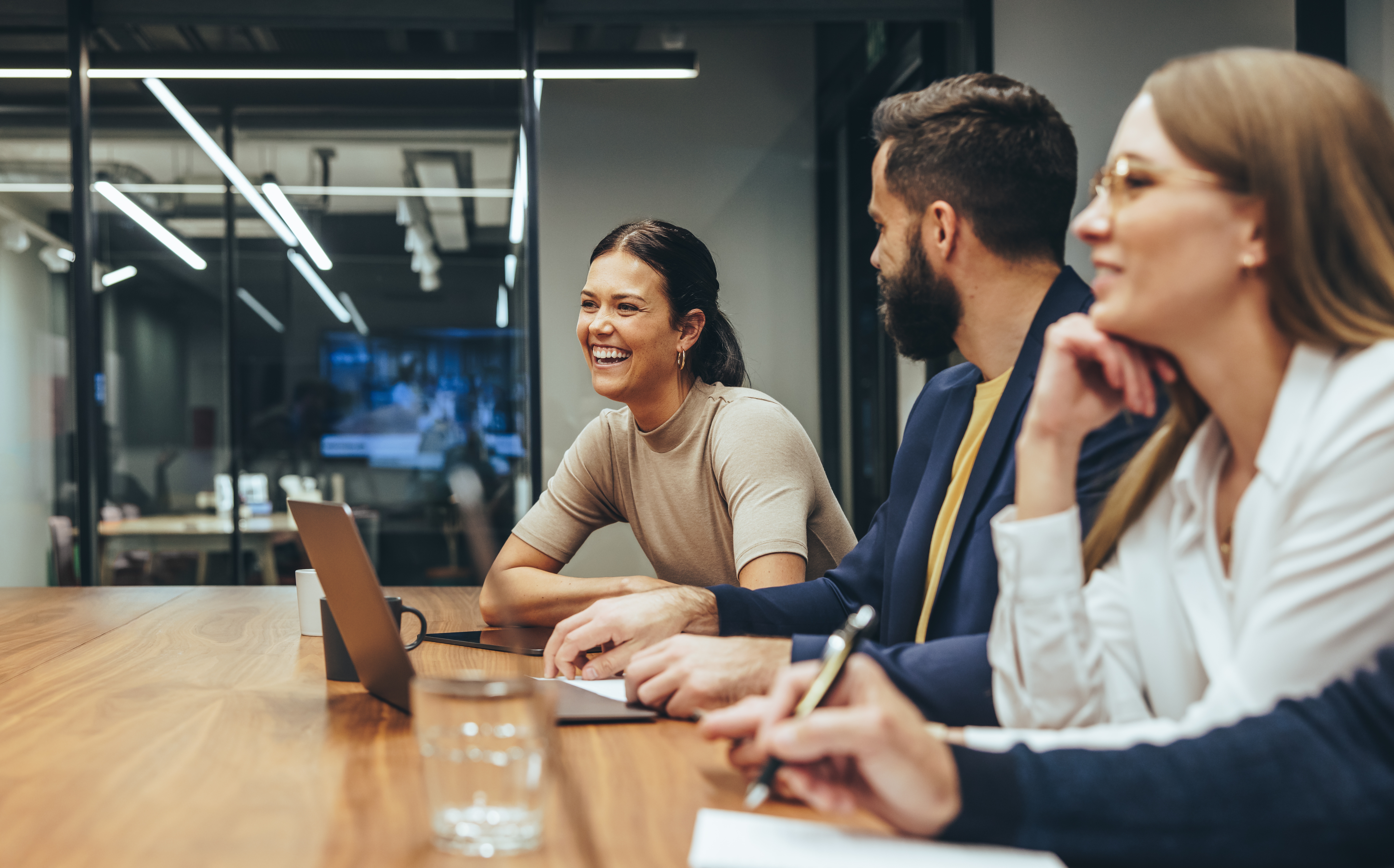 Colleagues in a meeting room in a modern office