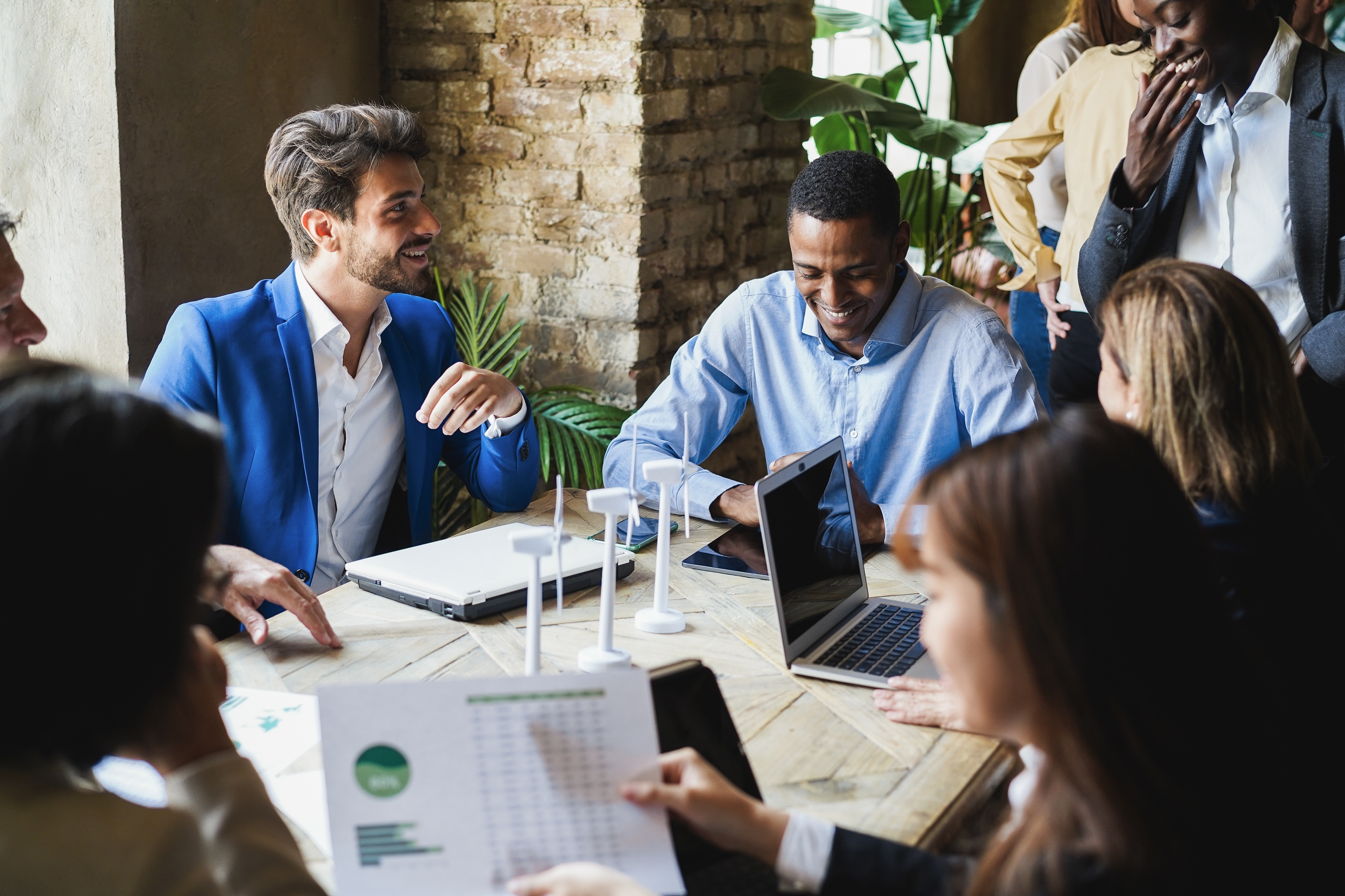 A group of executives making plans to eliminate food waste and paper waste 