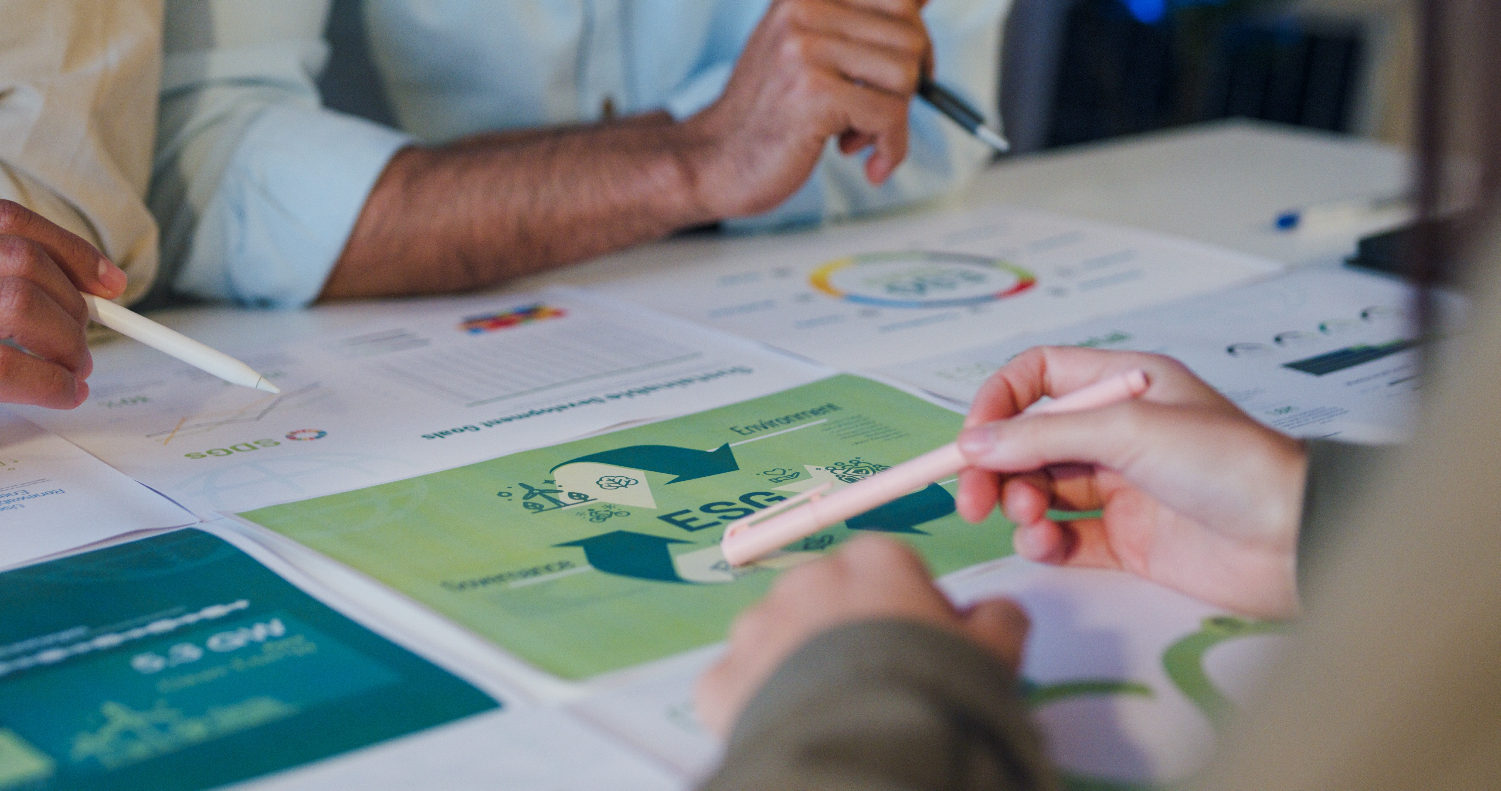 Employees discussing ESG strategy around a table