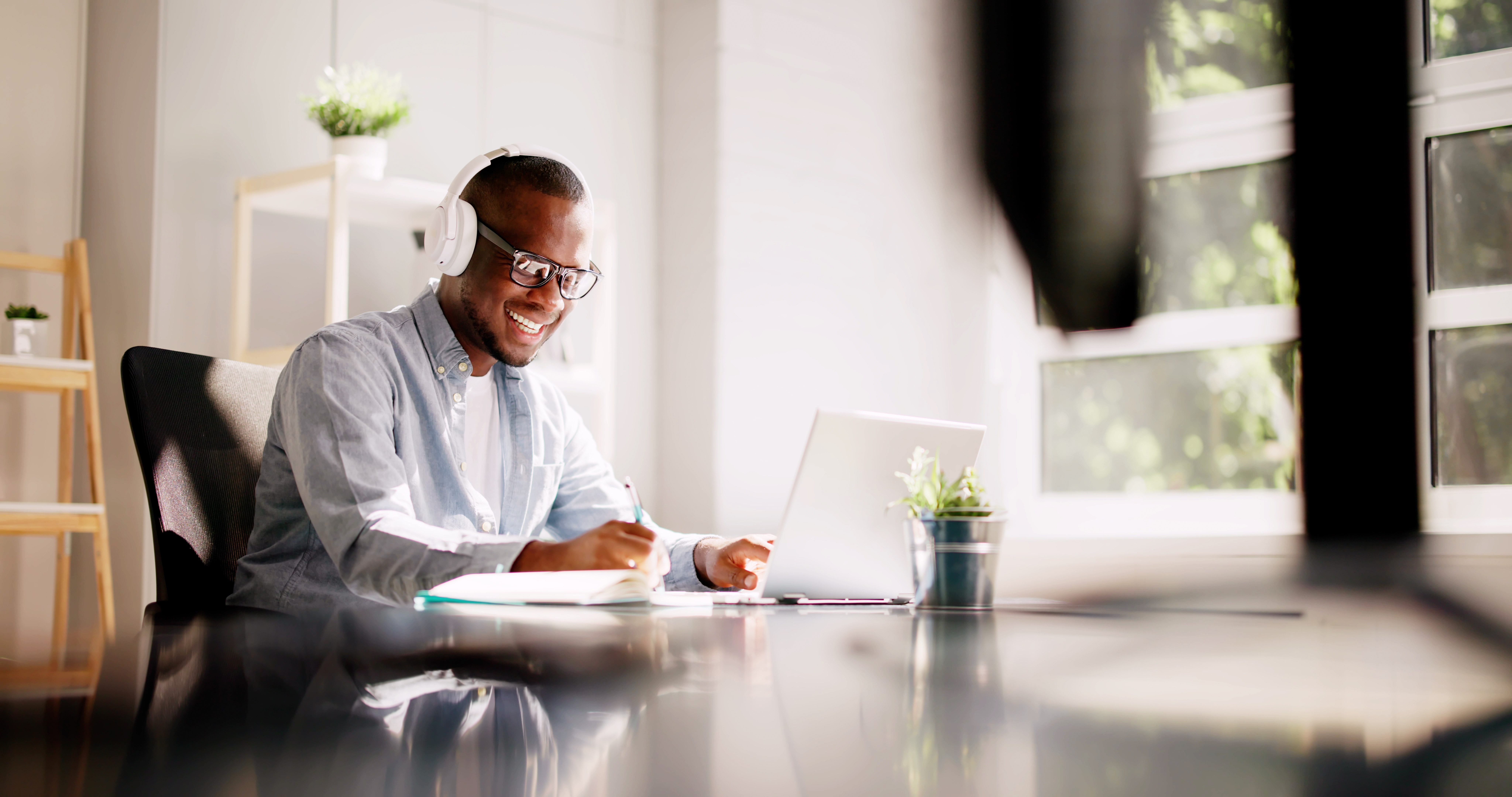 A man working from home with headphones on