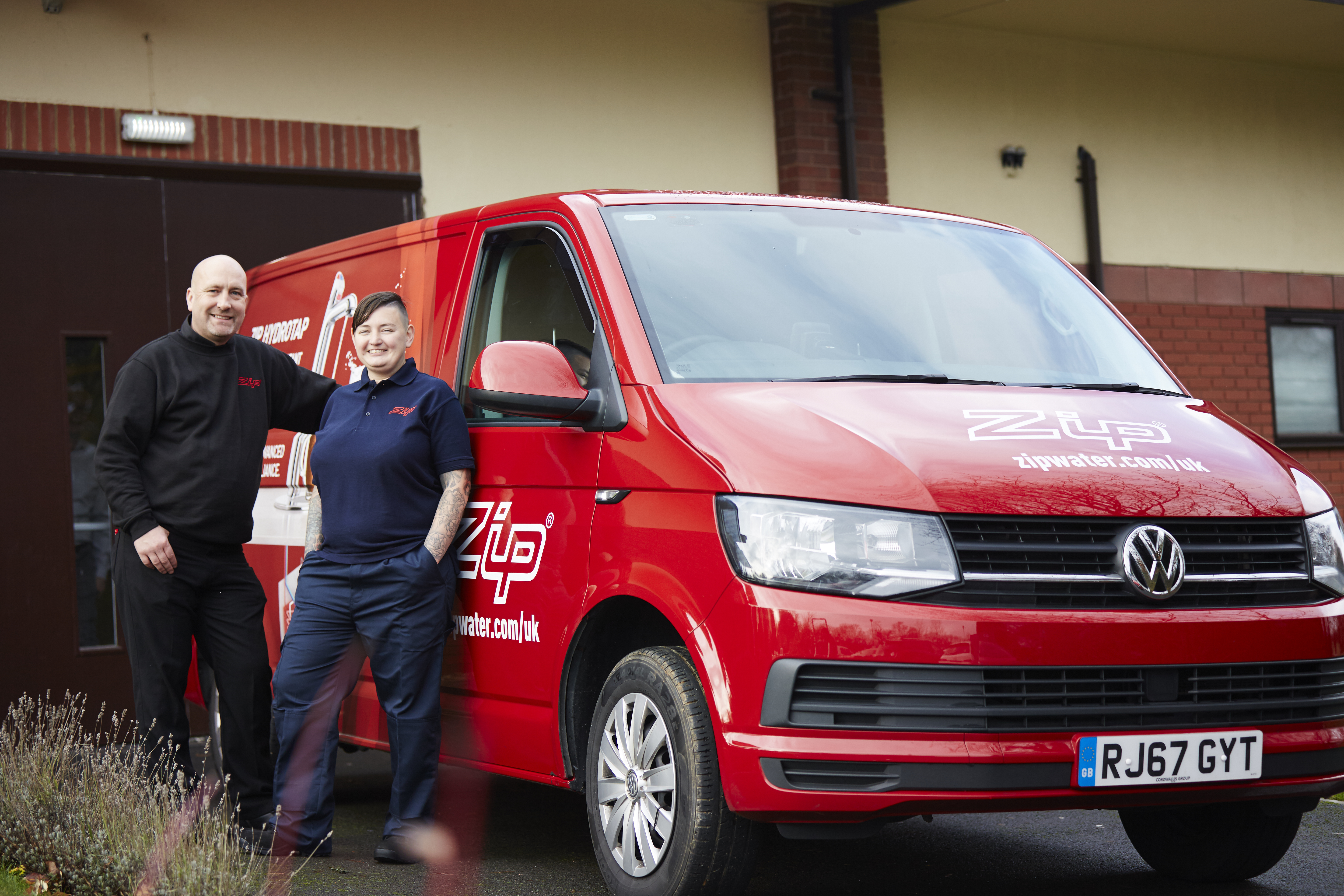 A Zip HydroCare van and two team members